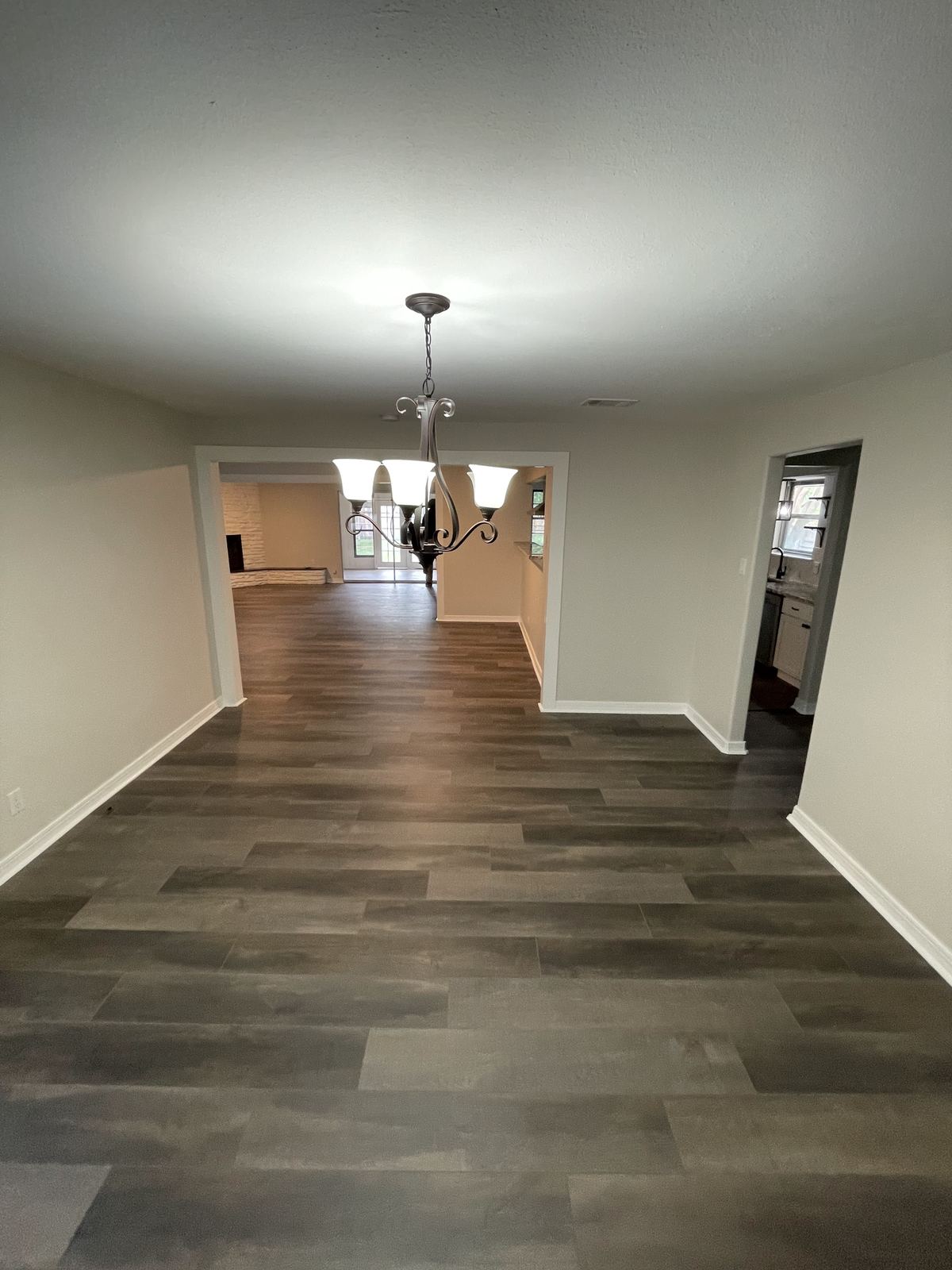 Renovated dining area with chandelier