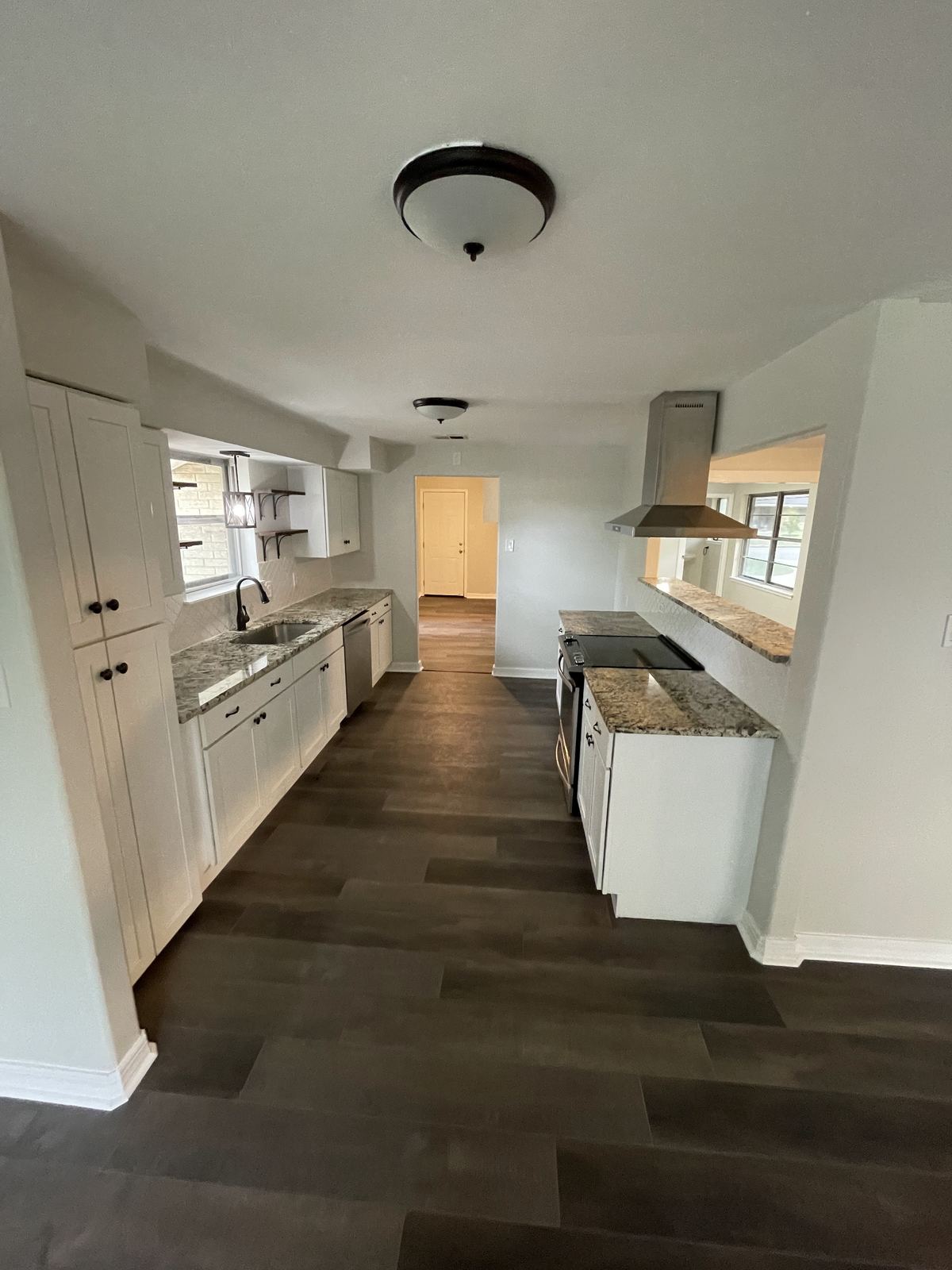 Finished renovated kitchen with new floors and cabinets